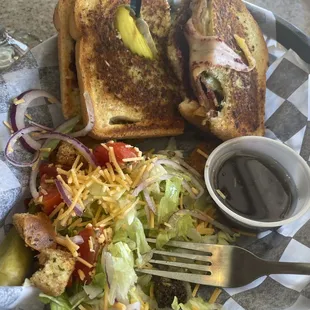 The crazy four cheese sandwich, add bacon, acc blackberry jam + side salad with sweet basaltic.