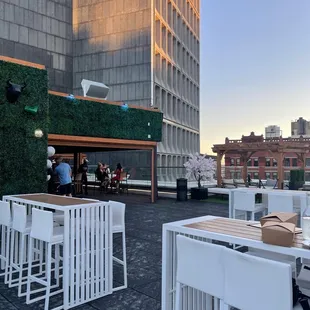 tables and chairs on a rooftop