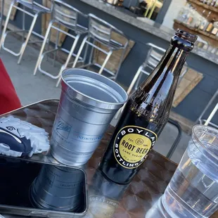 A root beer and a cool metal cup