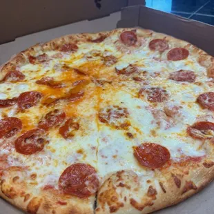 a pepperoni pizza in a box