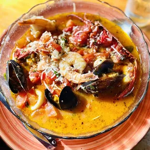 Cioppino - seafood stew of shrimp, scallops, lobster, clams, mussels, calamari, and fish sautéed in a tomato saffron broth