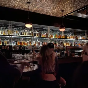 people sitting at a bar