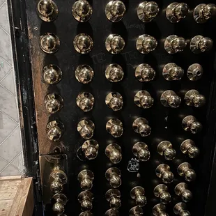 a bunch of shiny metal knobs