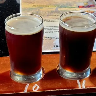 four different types of beer on a tray