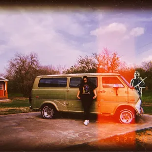 a man standing next to a van