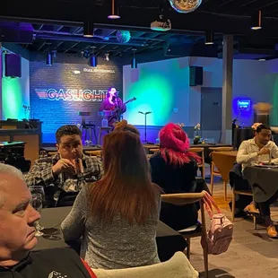 a group of people sitting in a restaurant