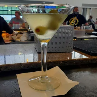 a martini with olives in it