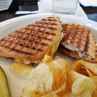 Bacon Cheese melt, cheddar, provolone, bacon and tomato on telera bread.