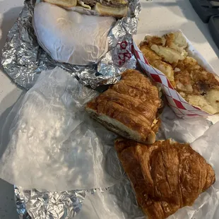 Steak bagel, steak croissant, and home fries