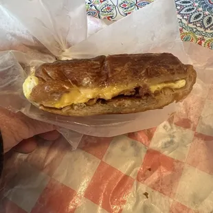 Bacon egg and cheese on a hot steamy buttery croissant.