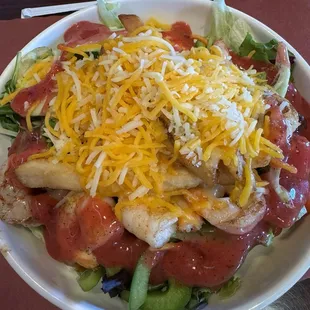 Salad with grilled shrimp and raspberry vinaigrette. Look for the fries!!
