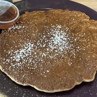 a pancake with powdered sugar on top