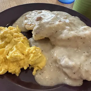 a plate of food with eggs and gravy