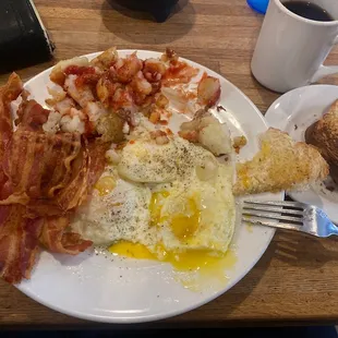 Eggs over medium bacon and home fries