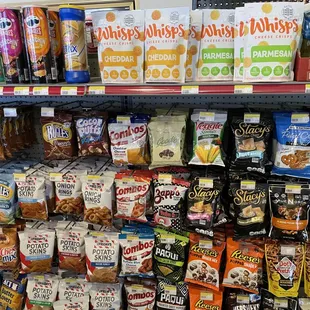 a variety of snacks on display in a grocery store