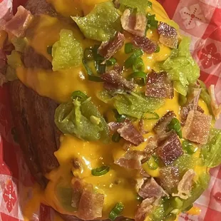 a cheeseburger with bacon and lettuce