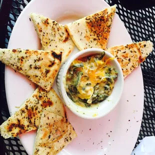 Spinach Dip with melted cheese on top.