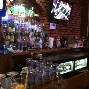 a bar with many bottles of alcohol