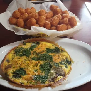 $2 basket of tots!!! Spinach mushroom and cheese omelet!! Yum!