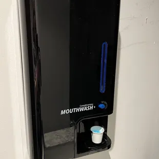 Mouthwash dispenser in the bathroom - nice touch!