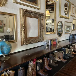 a row of boots lined up on a shelf