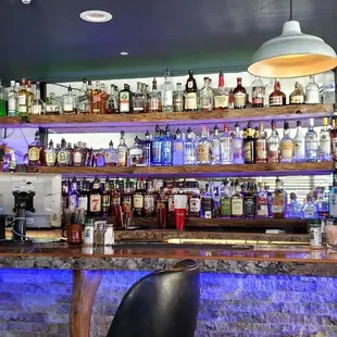 a bar with bottles of alcohol
