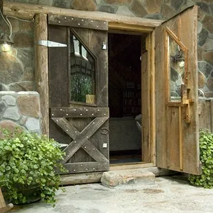 Beautiful Walnut doors beckon you into the cabin upon your arrival