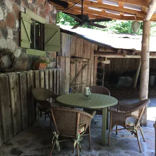 Porch with dining table and chairs, and a fan - great spot to have evening drinks and early morning breakfast.
