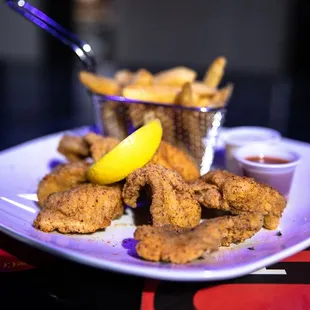 a plate of fried fish and fries