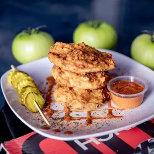 a plate of fried food and pickles