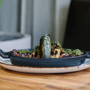 a plate of food on a wooden table