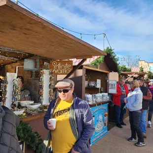 a man standing in front of a stall