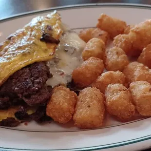 Steak omelet and taters.