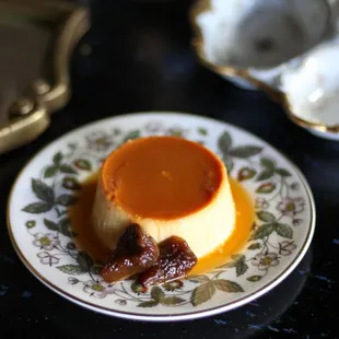 a plate of flan with caramel sauce