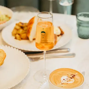 a plate of food and a glass of wine