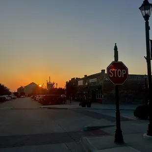a stop sign at sunset
