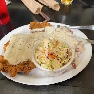 Texas Wagyu Chicken Fried Steak with mashed potatoes and gravy and coleslaw. Huge portion and delicious!