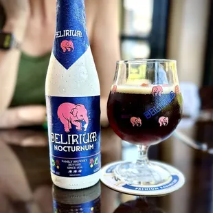 a bottle and a glass of beer