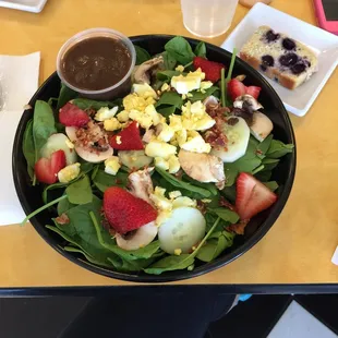 Spinach Salad ... it's huge! Baby spinach, fresh strawberries, cucumbers and mushrooms, bacon, and hard-boiled egg.