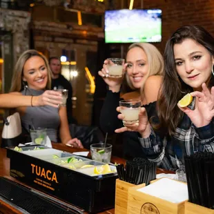 a group of women at a bar