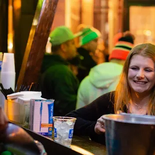a woman sitting at a bar