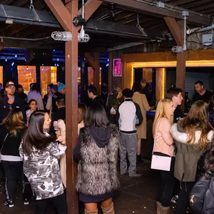 a large group of people standing around