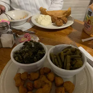 Fried catfish, mashed potatoes, turnip greens, fried okra, green beans and hush puppies!!!