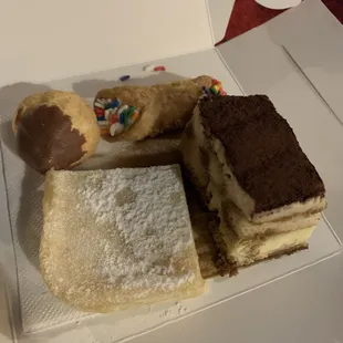 Tasty: cream puff, tiramisu , lemon bar and cannoli  We all shared in these sweets.