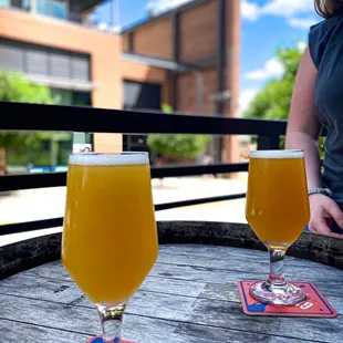 two glasses of beer on a table