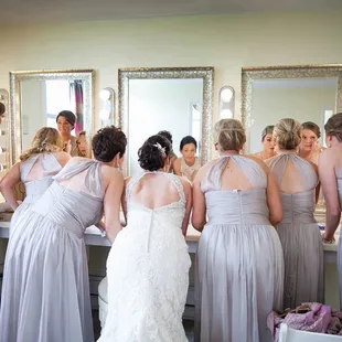 The Glendale Lyceum spacious bridal suite features a makeup counter with stools and lighted mirrors, comfy seating, and small kitchen.