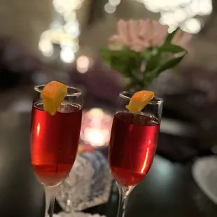 two glasses of wine on a table