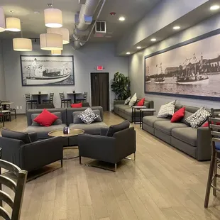a living room with couches and chairs
