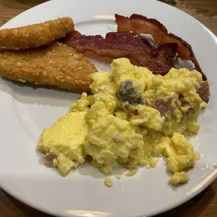 eggs, bacon and bread on a plate