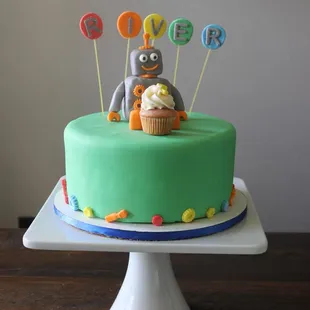 a cake with a robot on top